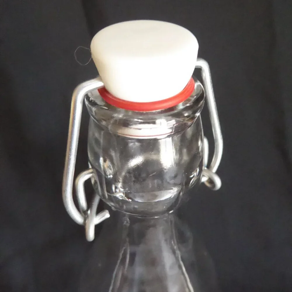 NEW 12.5” - 9.5” CRATE BARREL ITALY CLEAR GLASS AIR TIGHT LOCKING TOP 3 BOTTLES